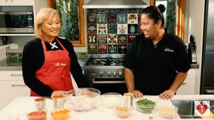 Sala Davai, from MoneyTalks, and Maria Bernard, from Heart Foundation cooking